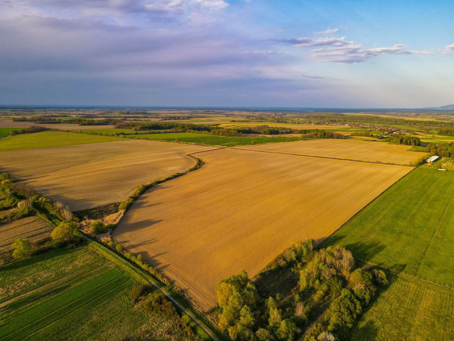 Stunning aerial view of expansive farmland and fields in Garešnica, Croatia during summer.